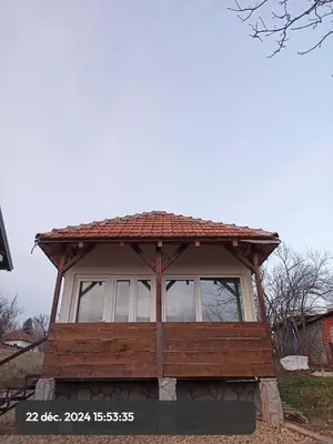 a small house with a roof on top of it at Stasha in Donja Mala