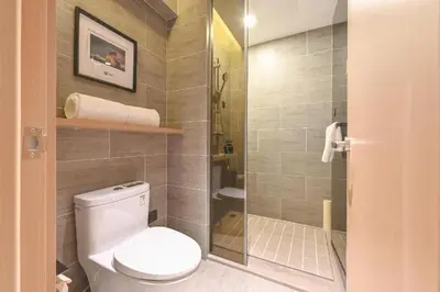 a bathroom with a toilet and a walk in shower at Günlük daire in Belgrade