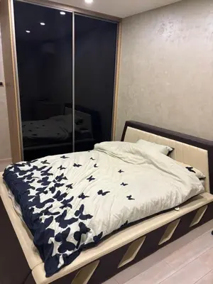 a bedroom with a bed with black butterflies on it at Luxurious apartment with a jaccuzi and 4 bedrooms in Belgrade