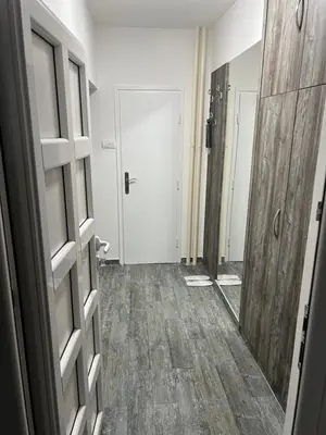 a room with a door and a hallway with a floor at Apartman Jevtic in Obrenovac