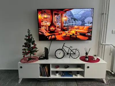 a living room with a christmas tree and a tv at Apartman Jevtic in Obrenovac