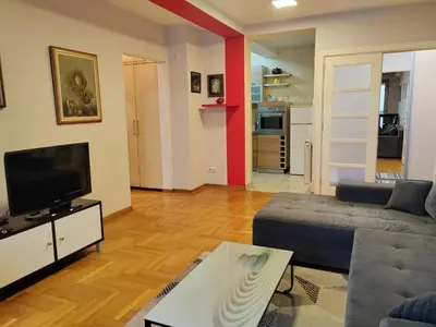 a living room with a couch and a tv at Flat near Belgrade Waterfront in Belgrade