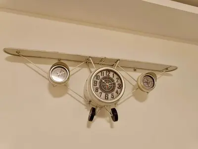 a clock hanging on a wall in a room at Beolight Apartment in Belgrade