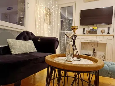 a living room with a couch and a table at Beolight Apartment in Belgrade