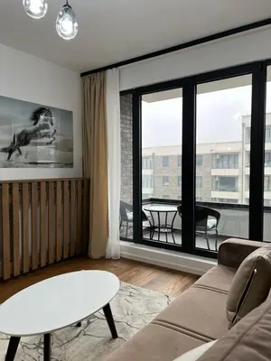 a living room with a couch and a table at Luxury Getaway with Comfort! in Belgrade