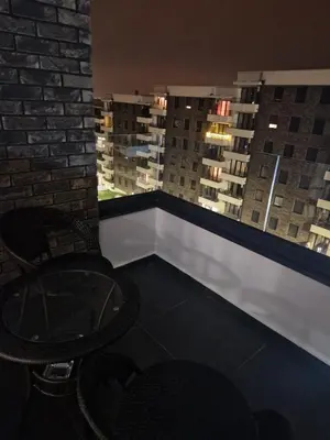 a room with two chairs and a view of the city at Luxury Getaway with Comfort! in Belgrade
