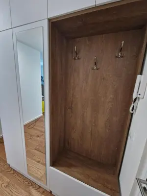 a wooden door in a kitchen with a mirror at Luxury Getaway with Comfort! in Belgrade
