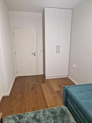 an empty room with a bed and a closet at Luxury Getaway with Comfort! in Belgrade