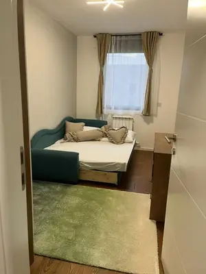 a small bedroom with a bed and a window at Luxury Getaway with Comfort! in Belgrade