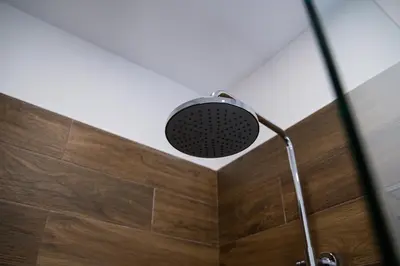 a shower with a shower head in a bathroom at Atelier in Belgrade