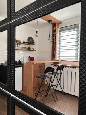 a kitchen with a table and two chairs at Apartment 5th in Belgrade