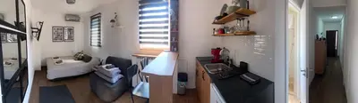a room with a kitchen and a living room at Apartment 5th in Belgrade