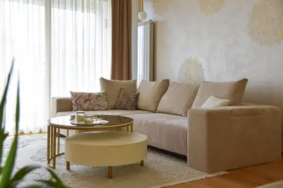 a living room with a couch and a table at Casa Novi Dorcol Belgrade in Belgrade