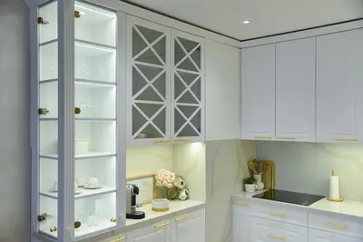 a kitchen with white cabinets and white counters at Casa Novi Dorcol Belgrade in Belgrade