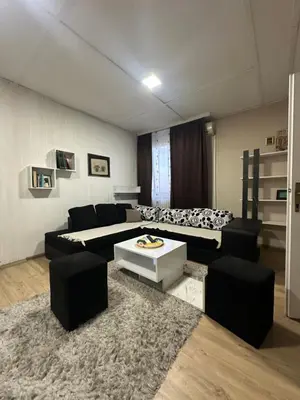 a living room with two beds and a couch at Apartman Riven in Borča