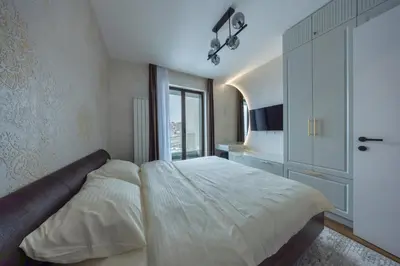 a bedroom with a large bed and a window at Casa Novi Dorcol Belgrade 2 in Belgrade