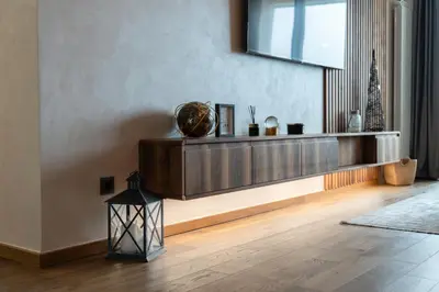 a living room with a wooden shelf on the wall at Casa Novi Dorcol Belgrade 2 in Belgrade
