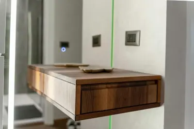 a bathroom with a wooden counter with a mirror at Casa Novi Dorcol Belgrade 2 in Belgrade