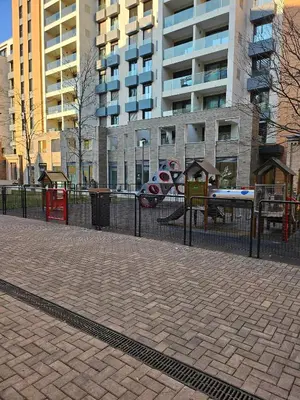 a playground in a city with tall buildings at Casa Novi Dorcol Belgrade 2 in Belgrade