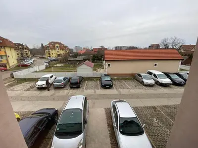 a group of cars parked in a parking lot at Perisic Apartman Obrenovac, sa parkingom in Obrenovac
