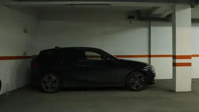 a black car parked in a parking lot at Mocha Belgrade Apartment in Belgrade