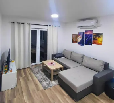 a living room with a couch and a table at Buku Hill in Arandjelovac