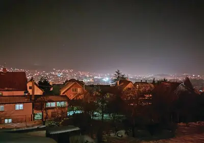 a view of a city at night at Buku Hill in Arandjelovac