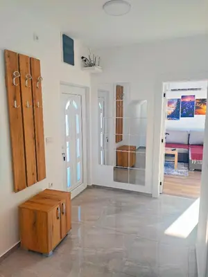 a room with a room with a bed and a wooden cabinet at Buku Hill in Arandjelovac