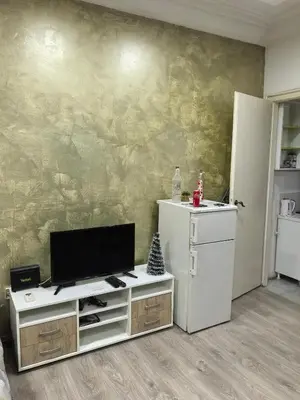 a living room with a flat screen tv on a wall at Belgrade Skadarlija Apartment - City center in Belgrade