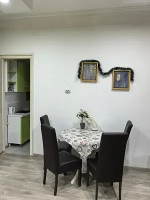 a dining room with a table and chairs at Belgrade Skadarlija Apartment - City center in Belgrade