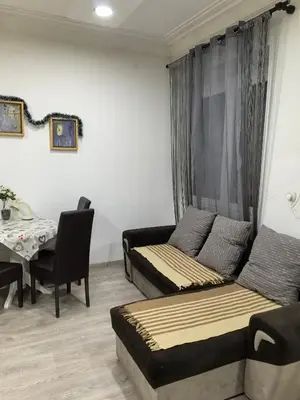 a living room with a couch and a table at Belgrade Skadarlija Apartment - City center in Belgrade