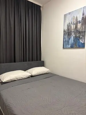 a bed in a room with a window and a painting at Boost Stay Apartment 1 in Belgrade