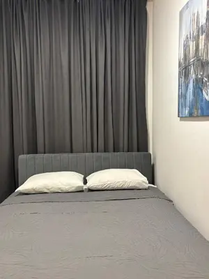 a bed with two pillows on it in a bedroom at Boost Stay Apartment 1 in Belgrade