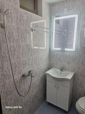 a bathroom with a shower and a sink and a toilet at Dream 7 in Belgrade