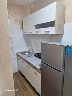 a kitchen with a sink and a refrigerator at Dream 7 in Belgrade