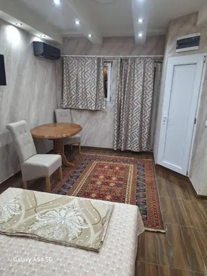 a room with a table and a table and chairs at Dream 7 in Belgrade