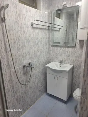 a bathroom with a shower and a sink and a toilet at Dream 7 in Belgrade