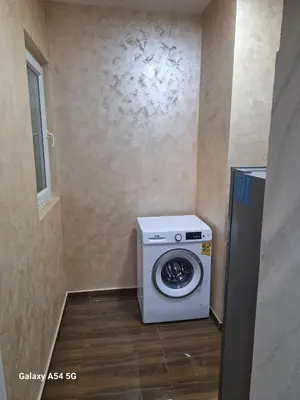 a washer and dryer in a small room at Dream 7 in Belgrade