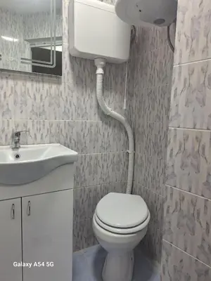 a bathroom with a toilet and a sink at Dream 7 in Belgrade