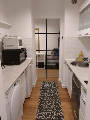 a small kitchen with a sink and a microwave at Fiore in Belgrade