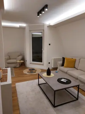 a living room with a couch and a table at Fiore in Belgrade
