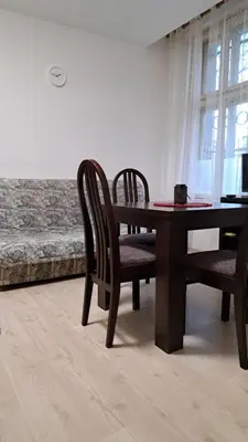 a dining room with a table and two chairs at Industrial 29N in Belgrade