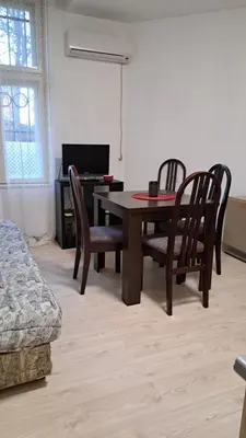 a dining room with a table and chairs and a desk at Industrial 29N in Belgrade