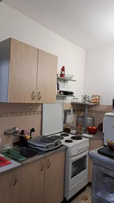 a kitchen with a stove and a sink at Industrial 29N in Belgrade