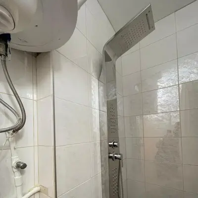 a shower with a glass door in a bathroom at Apartman Hram in Belgrade