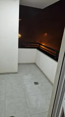 a view of a room with a tile floor at Finans2 in Ruma