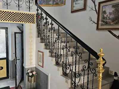 a stairway with a black and white stair railing at Belgrade Luxury Suite 17 in Belgrade