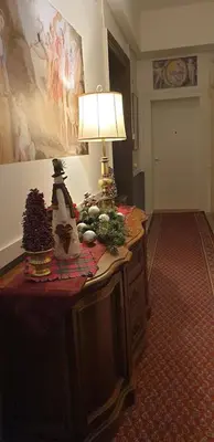 a room with a table with a lamp and christmas decorations at Belgrade Luxury Suite 17 in Belgrade