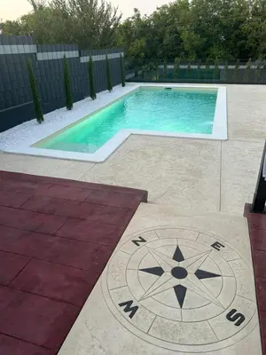 a swimming pool with a clock in front of it at Elysium Garden in Belgrade