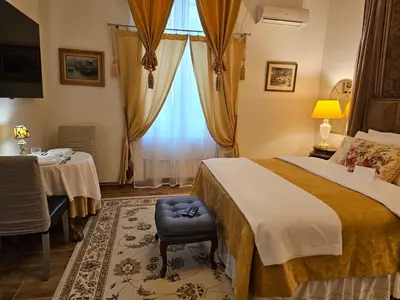 a hotel room with a bed and a table at Belgrade Luxury Suite 19 in Belgrade